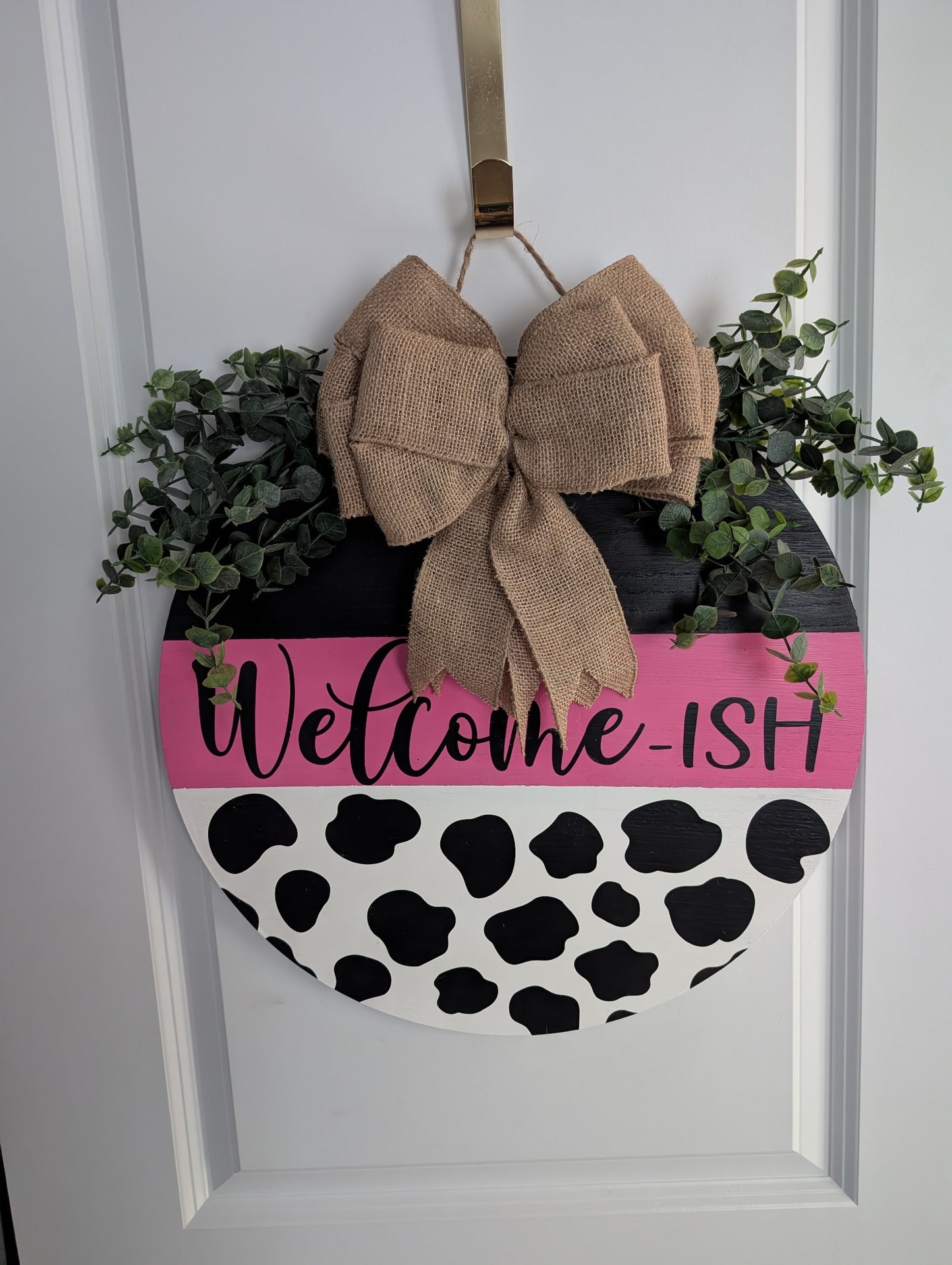Welcome-ish Custom Cow Print Door Hanger with "Welcome-ISH" Text and Decorative Elements - Hanging